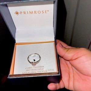 Im selling a Cubic Zirconia 18K Rose Gold Sterling Silver brand New
